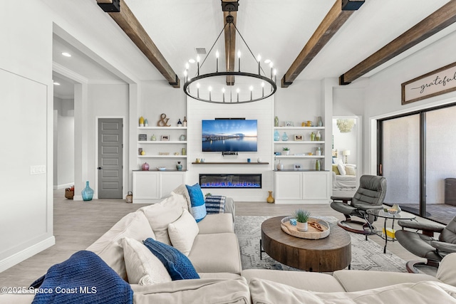 living room featuring light hardwood / wood-style flooring, a chandelier, and beamed ceiling