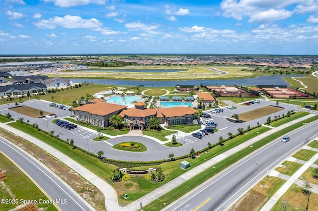 birds eye view of property with a water view