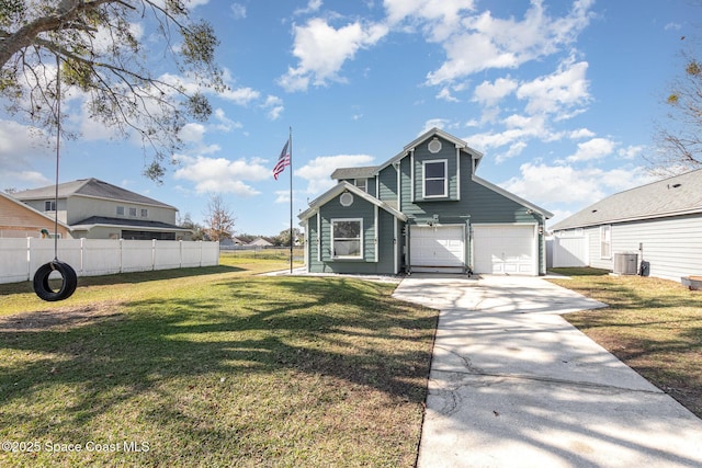 view of property with central air condition unit, a front lawn, and a garage