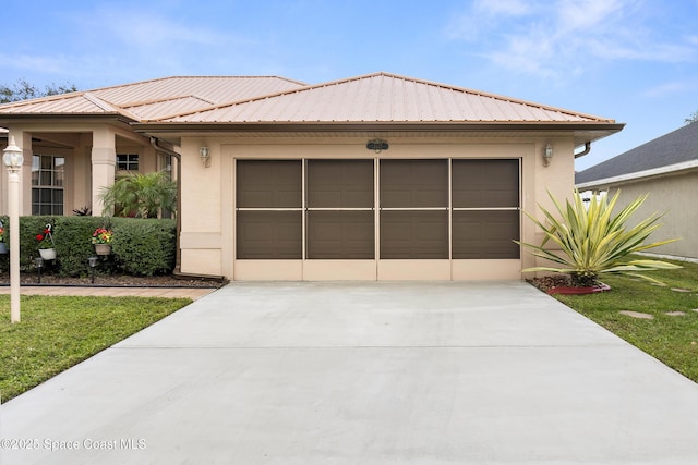 view of front of property with a garage and a front yard