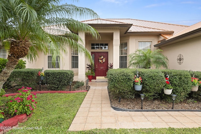 entrance to property with a yard