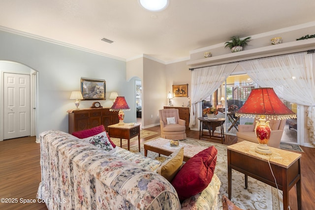 living room featuring crown molding and hardwood / wood-style flooring