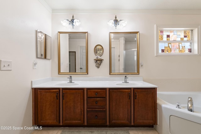 bathroom featuring a bath, crown molding, and vanity