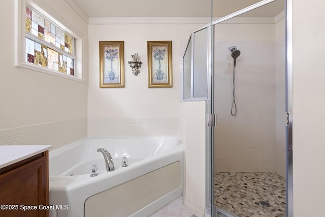 bathroom with plus walk in shower, crown molding, and vanity