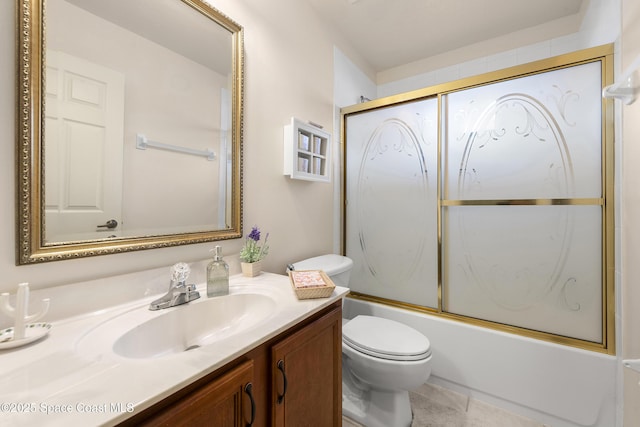 full bathroom with combined bath / shower with glass door, vanity, tile patterned flooring, and toilet