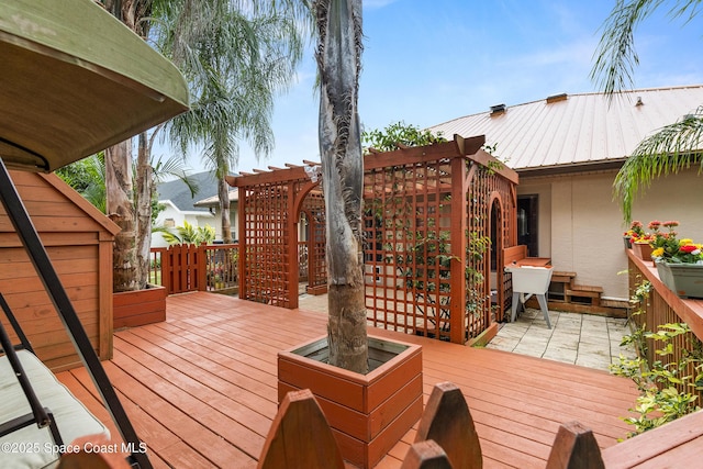 wooden deck featuring a pergola