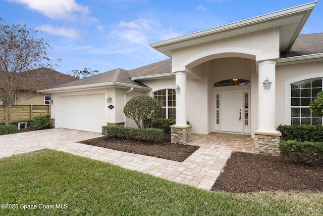 view of exterior entry featuring a garage