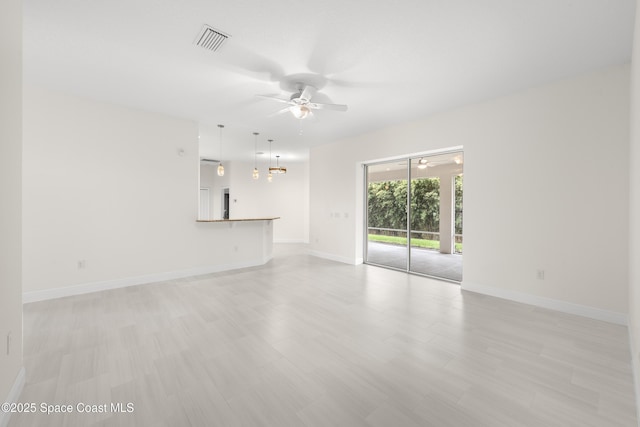 interior space with ceiling fan