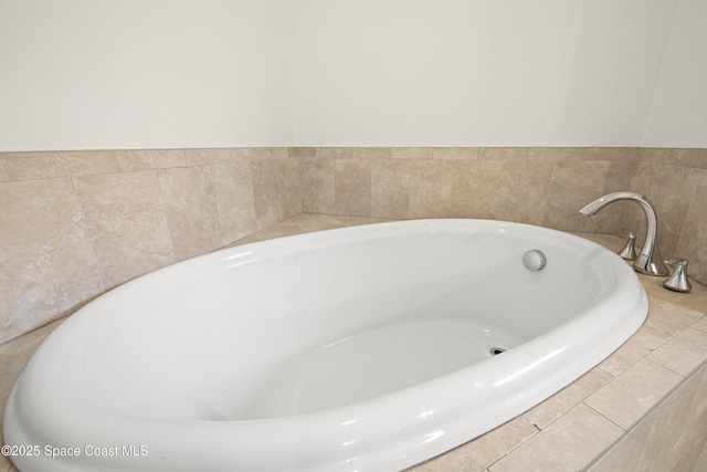 bathroom featuring a relaxing tiled tub