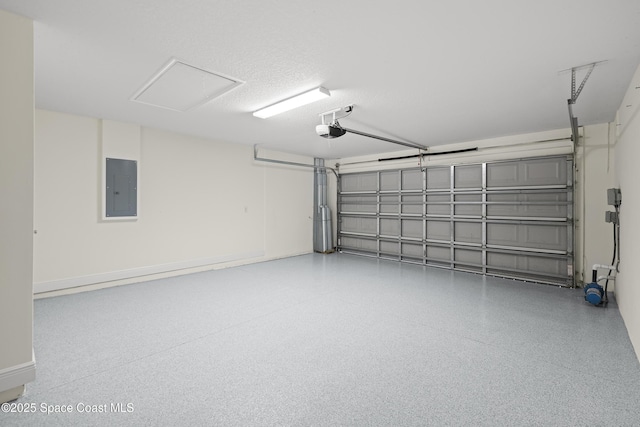 garage with a garage door opener and electric panel