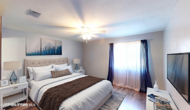 bedroom featuring wood-type flooring and ceiling fan