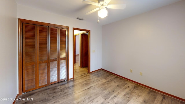 unfurnished bedroom featuring a closet, ceiling fan, and light hardwood / wood-style floors