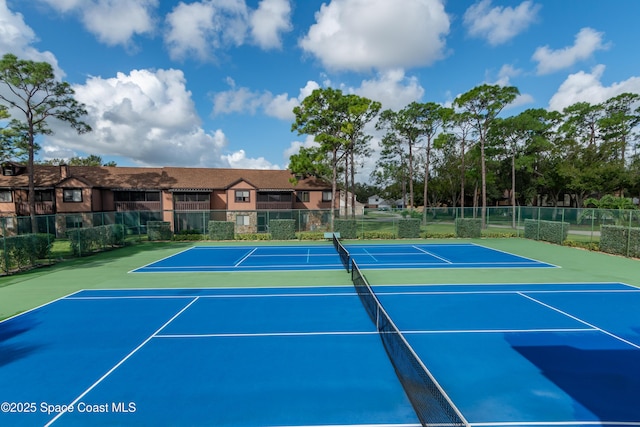 view of sport court with basketball hoop