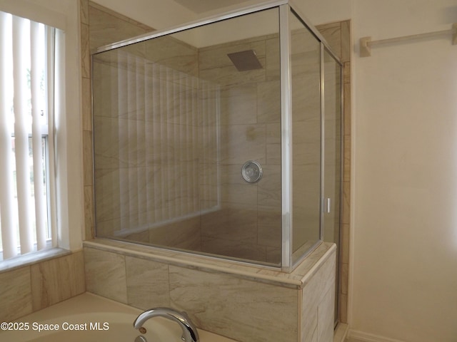 bathroom with shower with separate bathtub