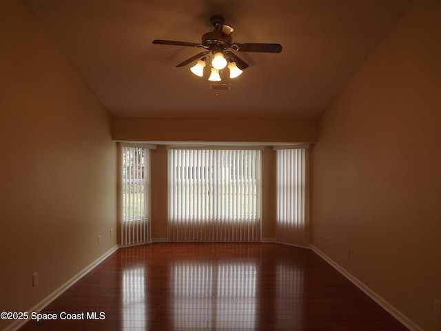 spare room with ceiling fan and wood-type flooring