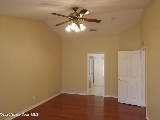 empty room with vaulted ceiling, hardwood / wood-style flooring, and ceiling fan