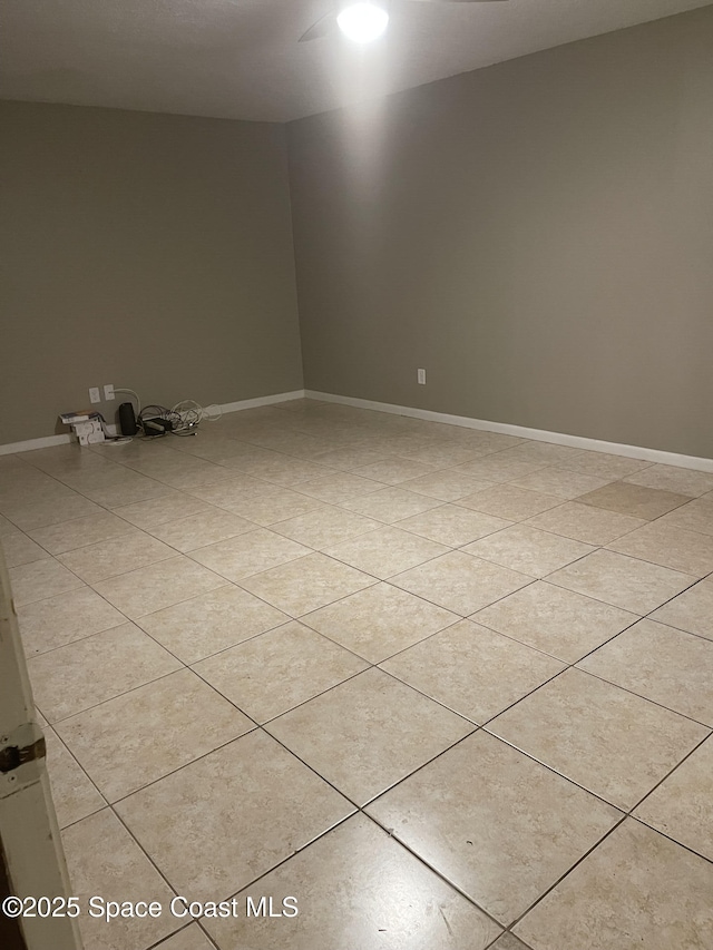 spare room with light tile patterned floors