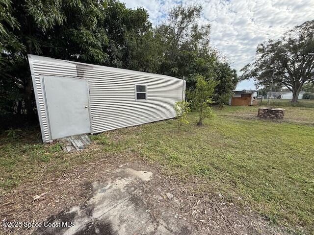 view of outdoor structure with a yard