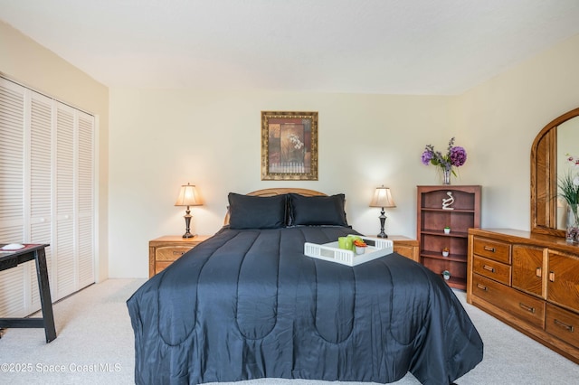 carpeted bedroom with a closet