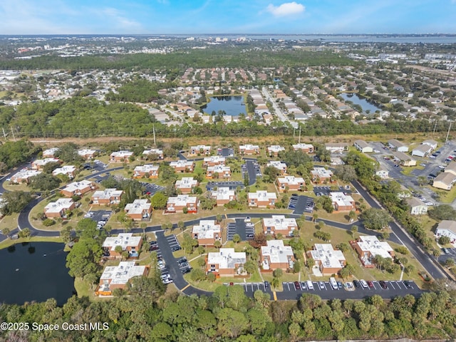 bird's eye view with a water view