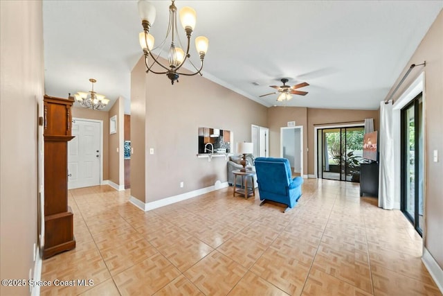 living room featuring vaulted ceiling, light parquet floors, and ceiling fan with notable chandelier