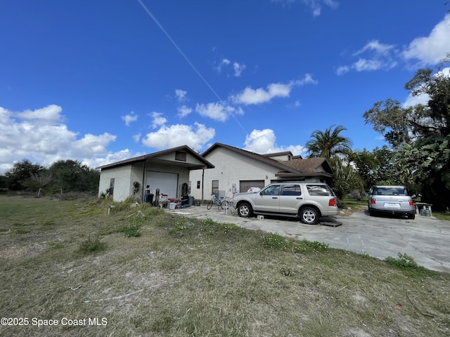 view of side of property featuring a garage