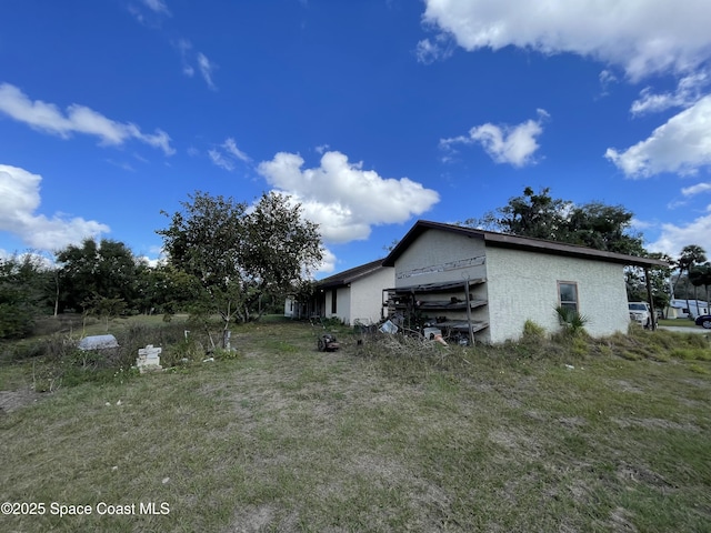 view of property exterior featuring a yard