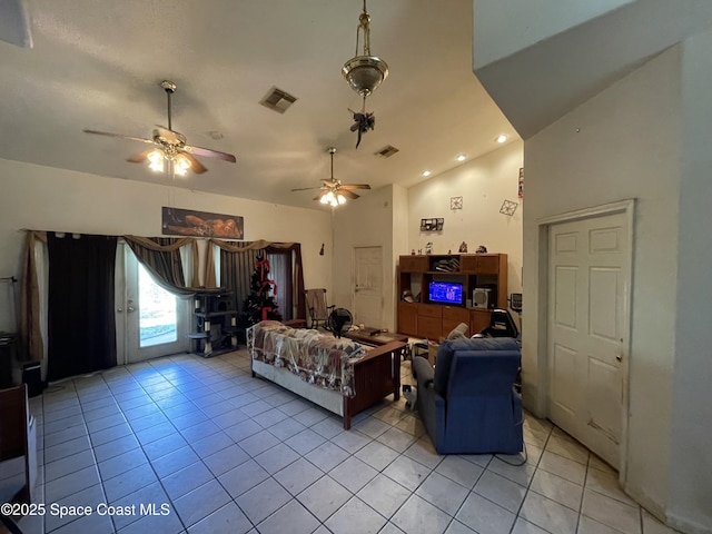 living room with vaulted ceiling and light tile patterned floors