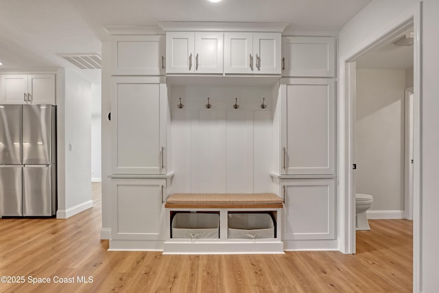 mudroom with light hardwood / wood-style flooring