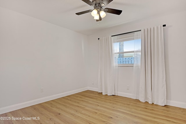 unfurnished room featuring ceiling fan and light hardwood / wood-style flooring