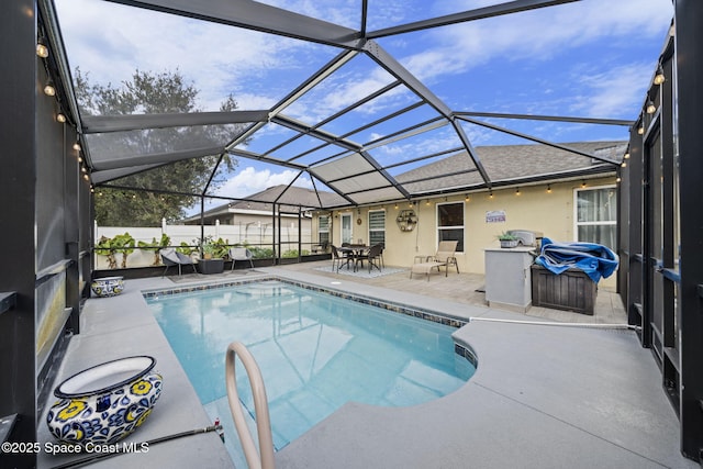 view of pool featuring a lanai and a patio area