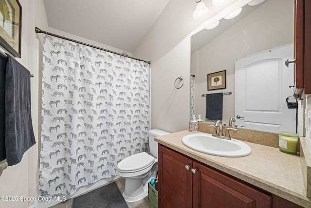 bathroom featuring toilet, a textured ceiling, vanity, and curtained shower