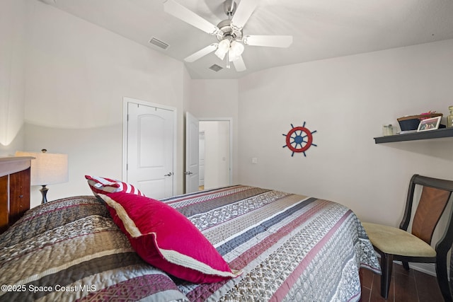 bedroom featuring ceiling fan, lofted ceiling, and hardwood / wood-style flooring