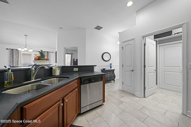 kitchen with dishwasher, decorative light fixtures, an inviting chandelier, sink, and light tile patterned floors