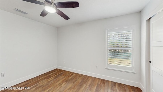 unfurnished room with hardwood / wood-style floors and ceiling fan