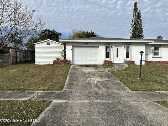 view of front of house with a garage and a front yard