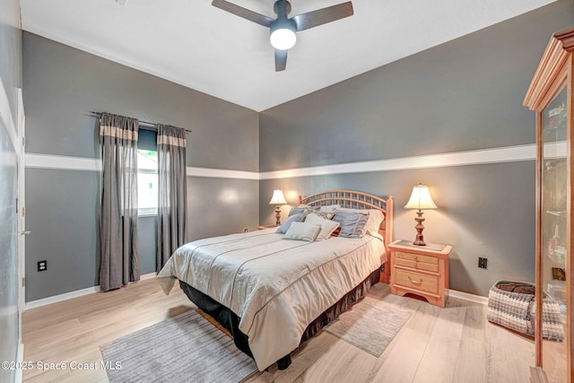 bedroom featuring ceiling fan and light hardwood / wood-style flooring