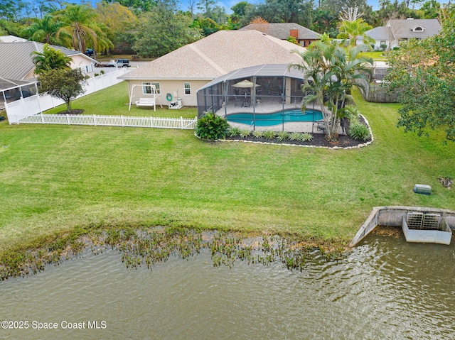 birds eye view of property with a water view