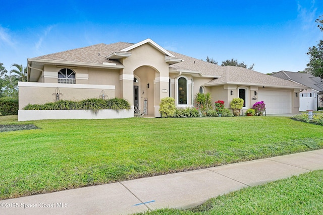 view of front facade featuring a garage and a front yard