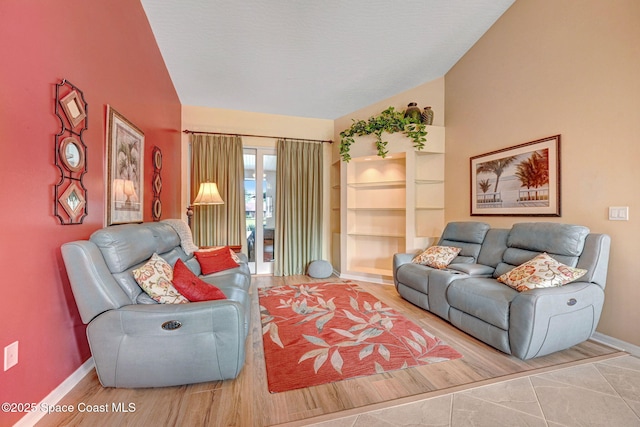 living room with lofted ceiling