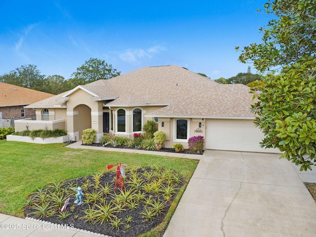 ranch-style house featuring a front lawn and a garage