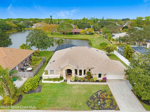 birds eye view of property with a water view