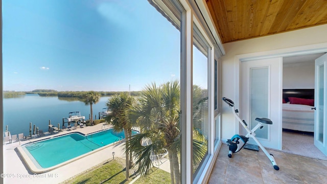 exterior space featuring a water view and a patio