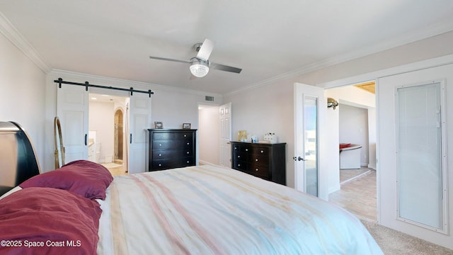 bedroom with ceiling fan, ensuite bathroom, ornamental molding, and a barn door