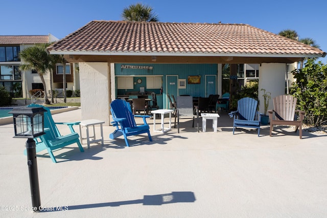 rear view of house featuring a gazebo and a patio