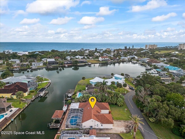 drone / aerial view with a water view