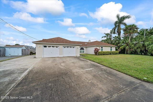 view of front of home with a garage and a front yard