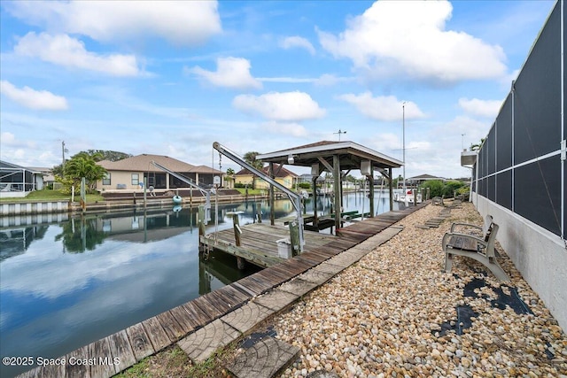 view of dock featuring a lanai and a water view