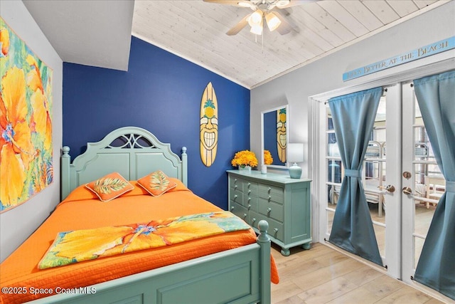 bedroom with wood ceiling, ceiling fan, ornamental molding, light hardwood / wood-style flooring, and lofted ceiling