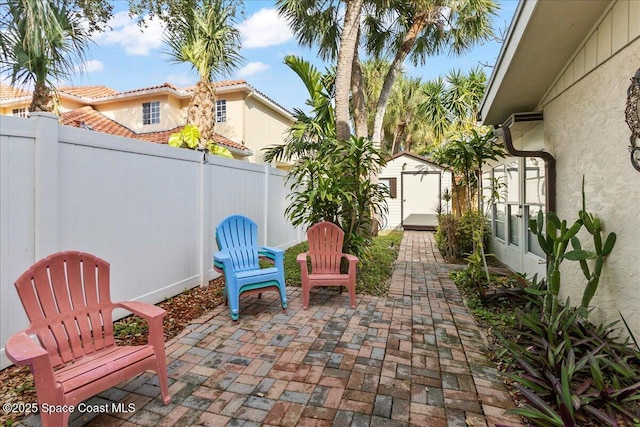 view of patio / terrace featuring a shed